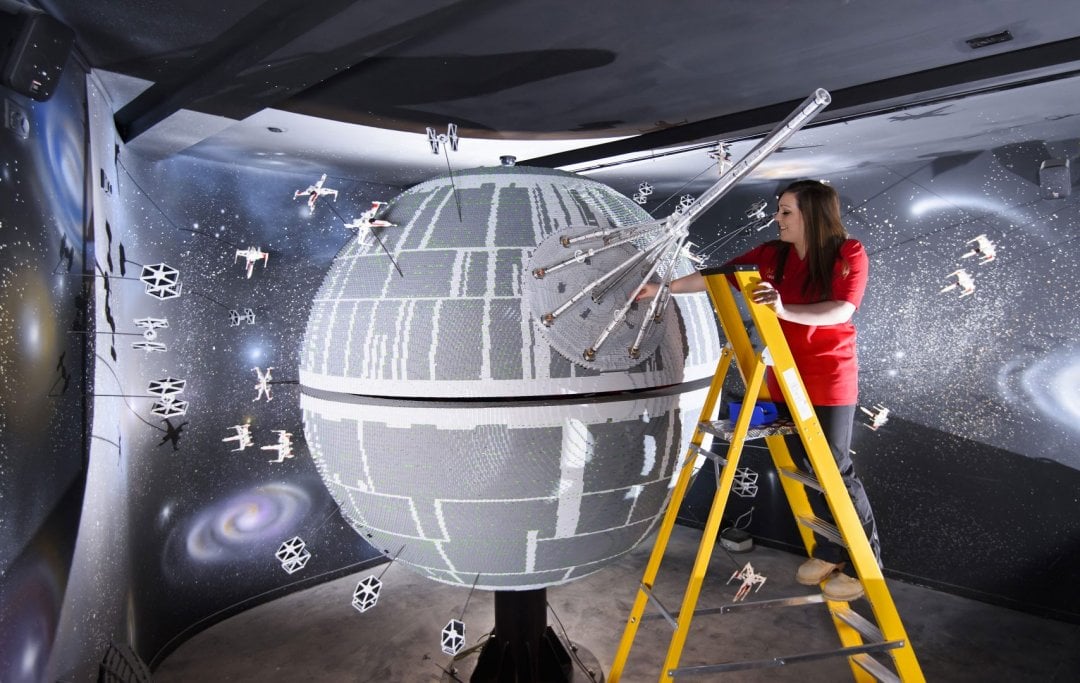 ONE OF THE WORLD’S BIGGEST EVER LEGO® STAR WARS™ MODELS INSTALLED AT THE LEGOLAND® WINDSOR RESORT. LAST PIECES PUT IN PLACE ON 500,000 LEGO® BRICK DEATH STAR. LEGOLAND® Model Maker, Phoebe Rumbol, puts the finishing touches to one of the most impressive and biggest LEGO® Star Wars™ models ever created as a 500,000 brick LEGO® Star Wars™ recreation of The Death Star is installed in a new finale to the Resort’s LEGO® Star Wars™ Miniland Model Display. The operation took three days as the massive new 2.4 metre wide, 3 metre high creation was carefully hoisted into position and the final bricks  were put in place. The hefty 860kg perfectly spherical model took 15 Model Makers three months to build and  guests can trigger special effects and bring the scene to life when it opens at the Resort on 11 March.