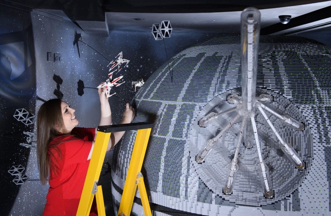 ONE OF THE WORLD’S BIGGEST EVER LEGO® STAR WARS™ MODELS INSTALLED AT THE LEGOLAND® WINDSOR RESORT.   LAST PIECES PUT IN PLACE ON 500,000 LEGO® BRICK DEATH STAR LEGOLAND® Model Maker, Phoebe Rumbol, puts the finishing touches to one of the Rebel Alliance ships featured in a new finale scene to the Resort’s LEGO® Star Wars™ Miniland Model Display.  Featuring one of the most impressive and biggest LEGO® Star Wars™ models ever created - a 500,000 brick LEGO® Star Wars™ recreation of The Death Star.   The models were installed in a mammoth operation that took three days as the massive new 2.4 metre wide, 3 metre high creation was carefully hoisted into position and the final bricks and scenes were put in place. The hefty 860kg perfectly spherical model took 15 Model Makers three months to build and guests can trigger special effects and bring the scene to life when it opens at the Resort on 11 March. TM & © Lucasfilm Ltd. All rights reserved
